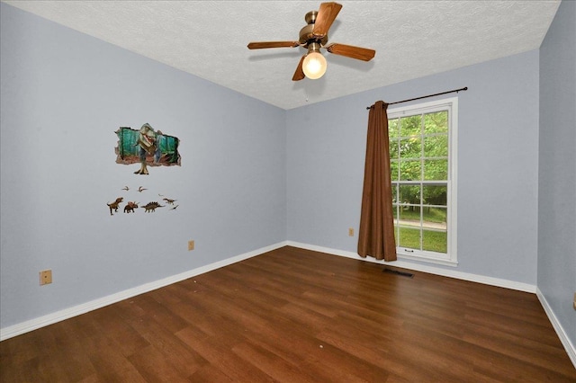  - unfurnished room with wood finished floors, a textured ceiling, baseboards, and ceiling fan