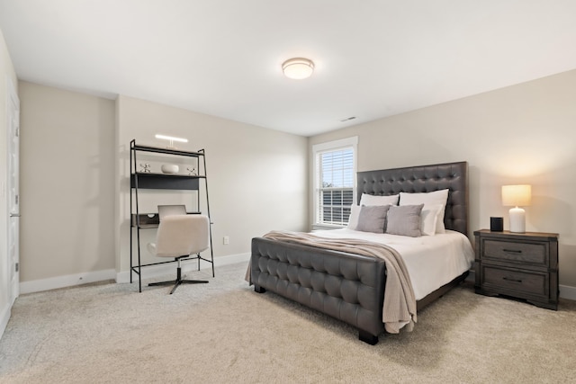 carpeted bedroom featuring baseboards