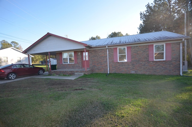 ranch-style house with a carport and a front yard