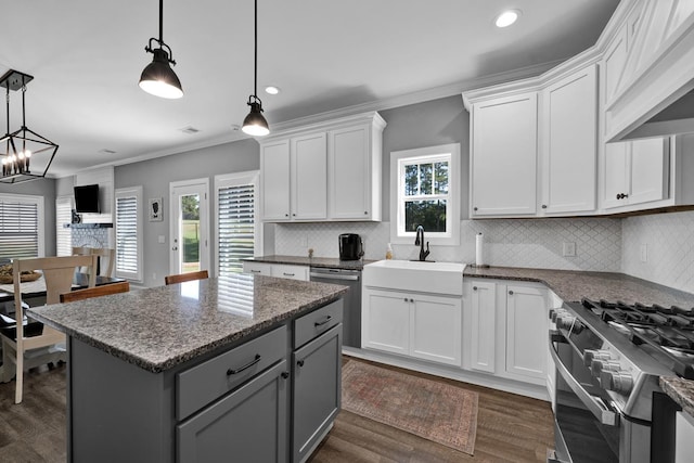 kitchen featuring pendant lighting, gray cabinetry, white cabinets, sink, and appliances with stainless steel finishes