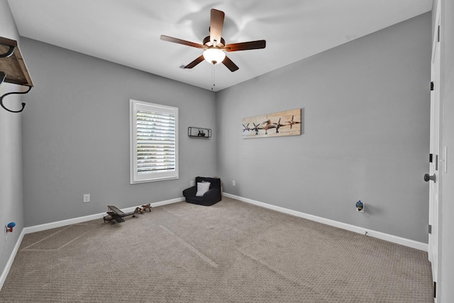 unfurnished room with carpet flooring and ceiling fan