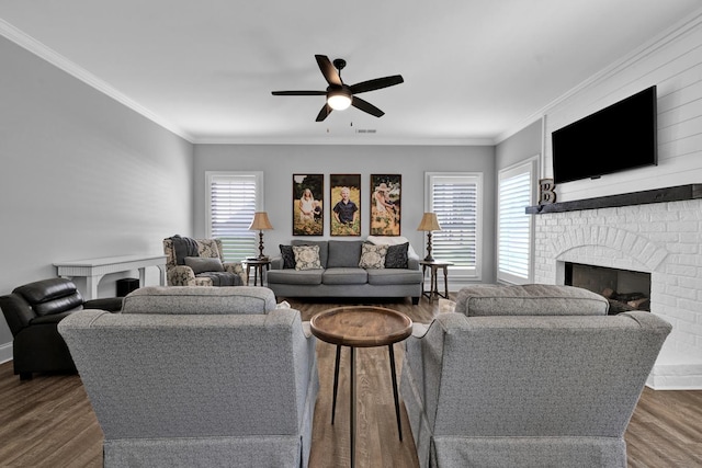 living room featuring dark hardwood / wood-style floors, a wealth of natural light, and ceiling fan