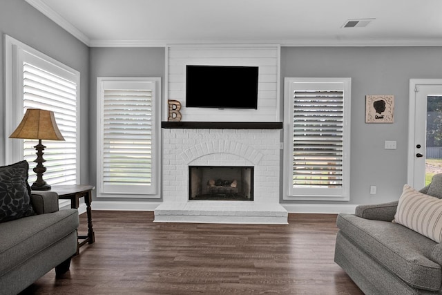 living room featuring a fireplace, dark hardwood / wood-style flooring, and ornamental molding