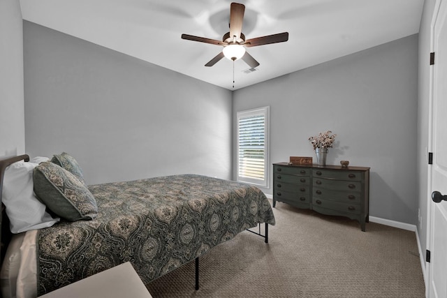 bedroom featuring ceiling fan and light carpet