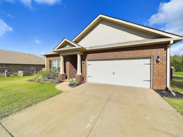 craftsman inspired home with a garage and a front lawn