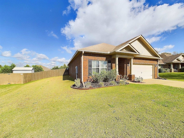 view of front of home with a garage and a front lawn