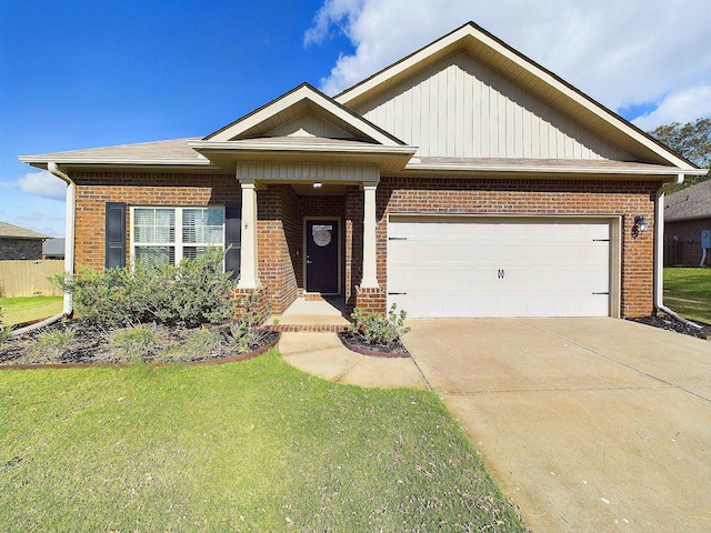 craftsman inspired home featuring a garage and a front lawn