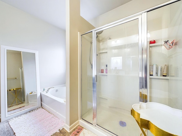 bathroom featuring independent shower and bath