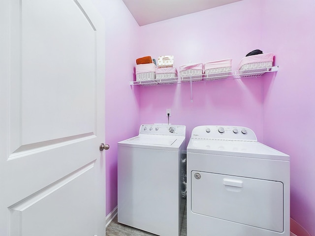 laundry area with separate washer and dryer