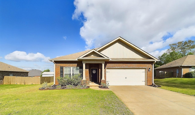 craftsman-style house featuring a garage and a front yard