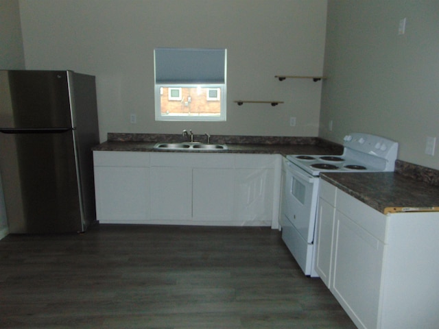 kitchen with stainless steel fridge, white range with electric stovetop, sink, white cabinets, and dark hardwood / wood-style floors