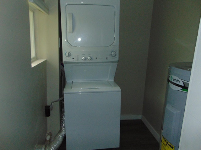 washroom featuring stacked washer / dryer