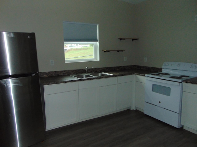 kitchen featuring dark hardwood / wood-style flooring, sink, white cabinetry, white electric stove, and stainless steel refrigerator