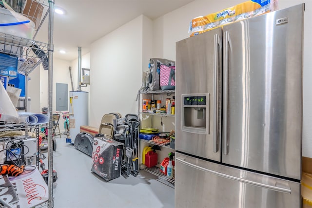 interior space featuring stainless steel fridge, electric panel, and water heater