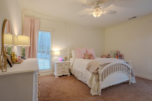 carpeted bedroom with ceiling fan and ornamental molding