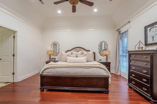 bedroom with ornamental molding, dark hardwood / wood-style floors, ceiling fan, and lofted ceiling