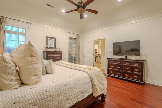 bedroom featuring ceiling fan, wood-type flooring, and ornamental molding