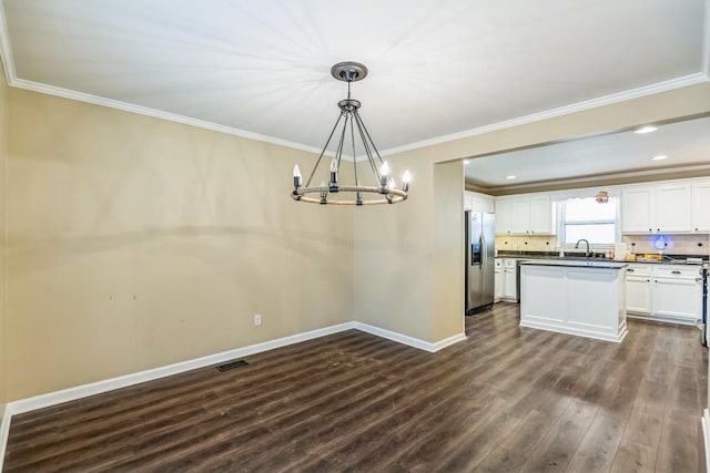 kitchen with backsplash, dark wood-type flooring, white cabinets, stainless steel fridge with ice dispenser, and hanging light fixtures