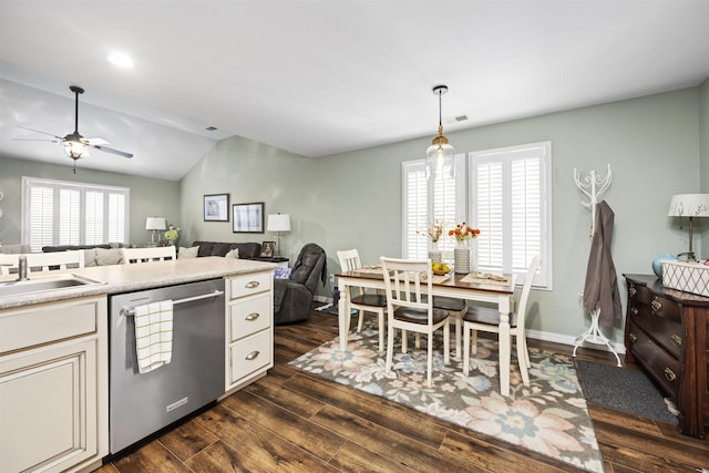 kitchen featuring dark wood-type flooring, visible vents, open floor plan, light countertops, and dishwasher