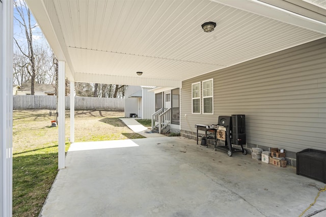 view of patio with entry steps and fence