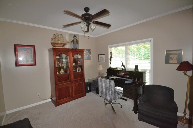 office with baseboards, ornamental molding, a ceiling fan, and light carpet