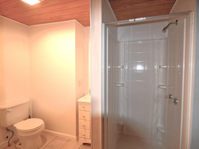 bathroom featuring a shower stall, toilet, and tile patterned flooring