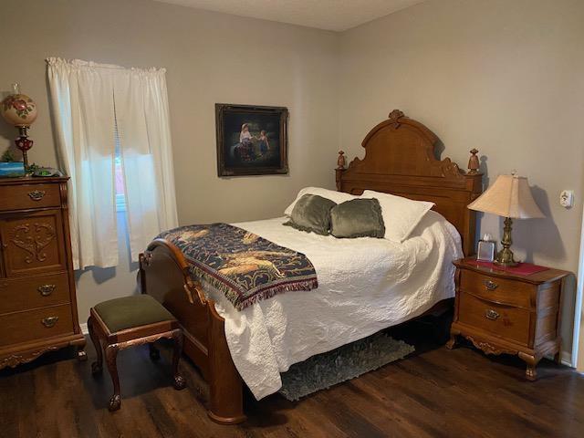 bedroom featuring dark hardwood / wood-style flooring