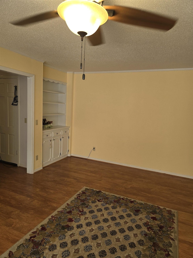 unfurnished living room with a textured ceiling, hardwood / wood-style floors, and built in features