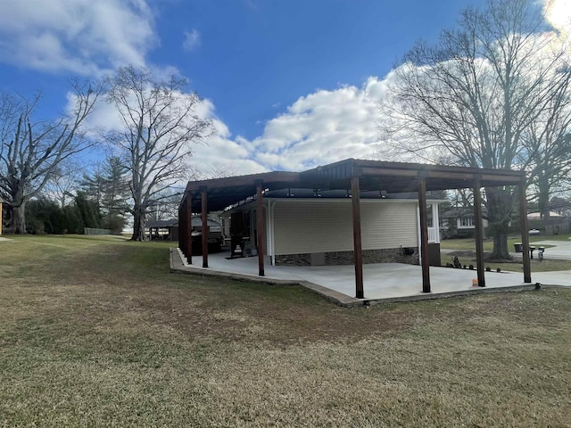 view of side of property with a yard and a patio area