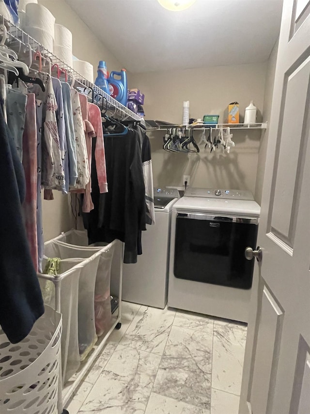 clothes washing area featuring washing machine and dryer