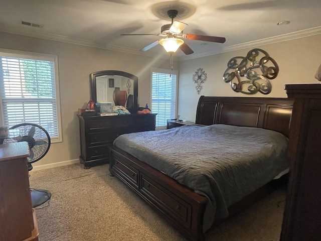 bedroom with light carpet, ceiling fan, and crown molding