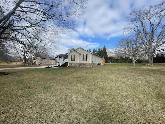 view of side of home featuring a lawn