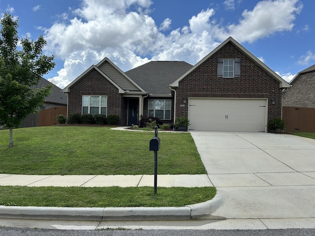  - view of front facade with brick siding, driveway, and a garage