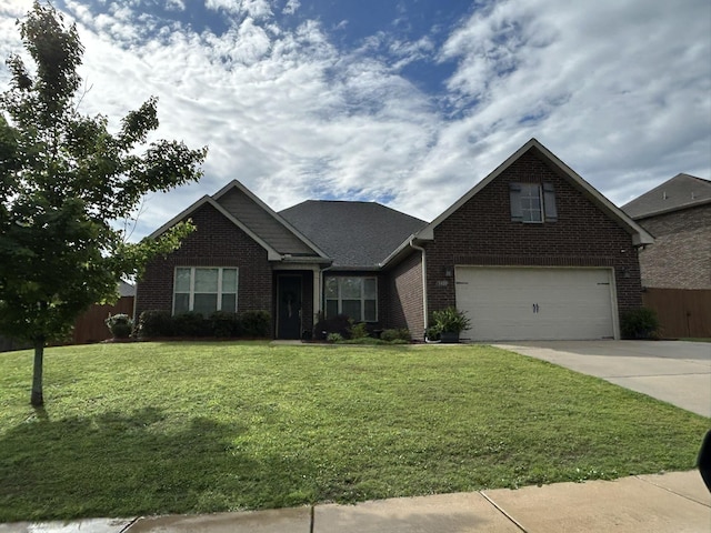  - view of front of home with brick siding, concrete driveway, and a garage