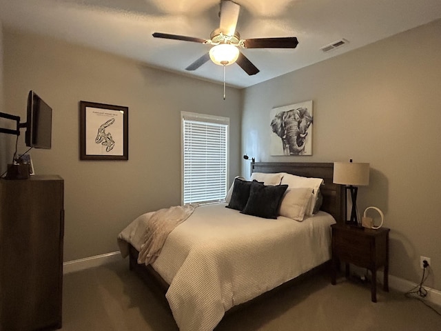  - carpeted bedroom featuring baseboards and ceiling fan