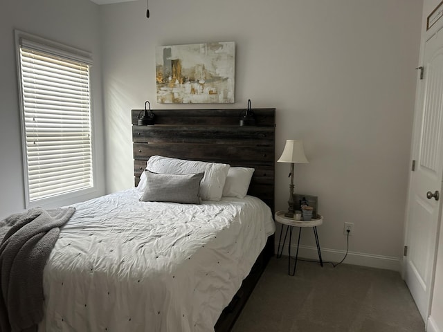  - bedroom with baseboards and carpet floors