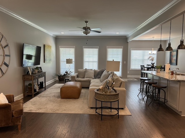  - living room featuring baseboards, ceiling fan, dark wood-type flooring, crown molding, and recessed lighting