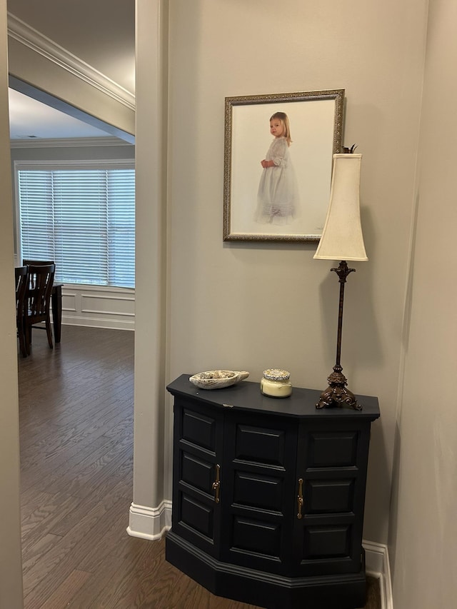  - corridor featuring ornamental molding, dark wood-style flooring, and baseboards