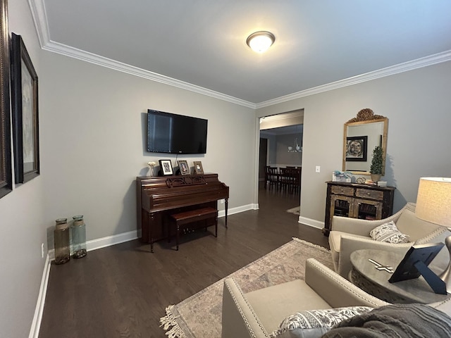  - living area featuring ornamental molding, dark wood-style flooring, and baseboards
