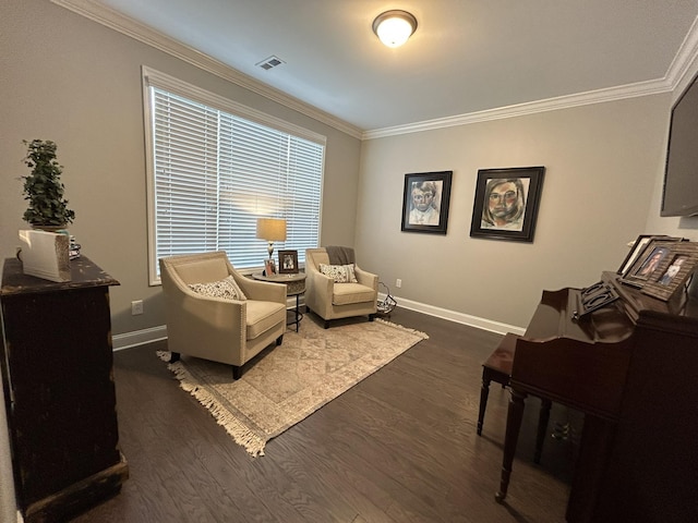  - living area featuring ornamental molding, baseboards, and wood finished floors