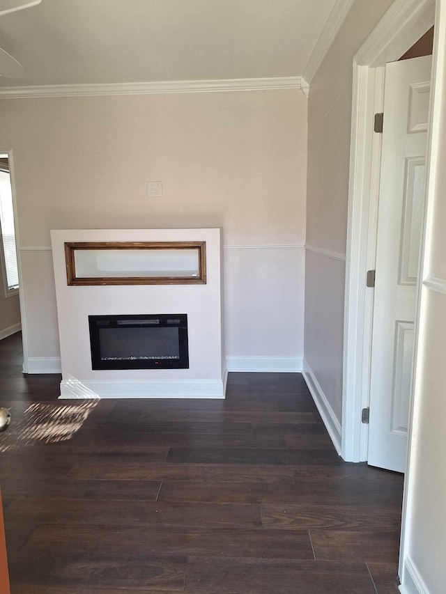 unfurnished living room with ornamental molding and dark wood-type flooring