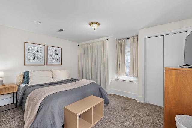 carpeted bedroom with a closet