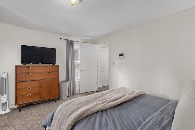 bedroom with light colored carpet