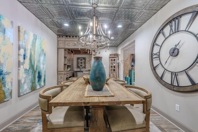  - dining area with a chandelier, baseboards, an ornate ceiling, wood finished floors, and recessed lighting