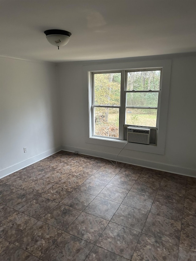 unfurnished room featuring cooling unit