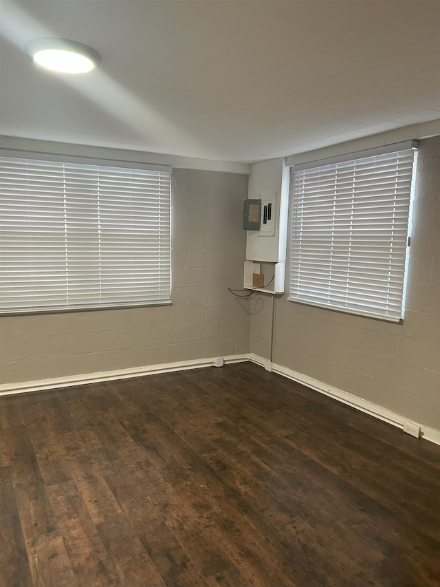 spare room featuring dark hardwood / wood-style flooring