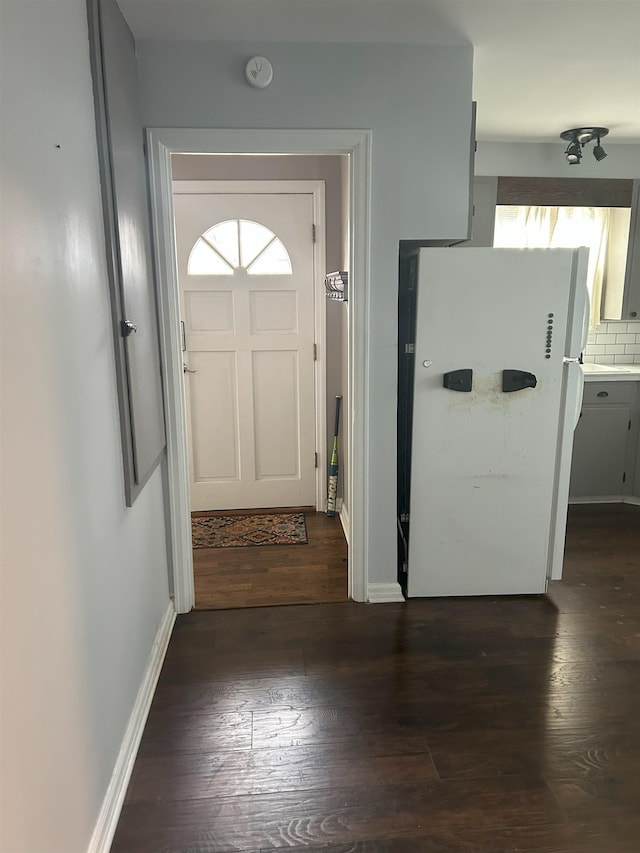 doorway with dark hardwood / wood-style floors