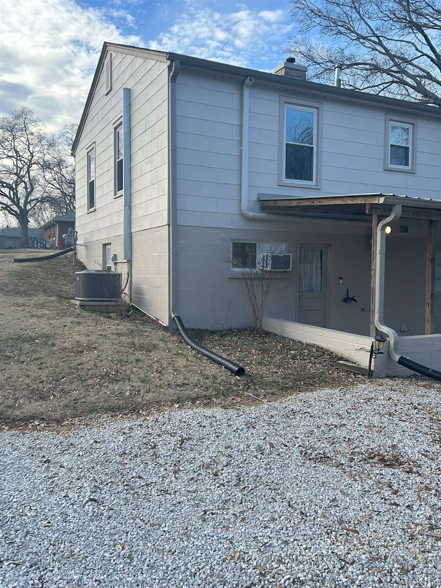 view of home's exterior with central AC unit