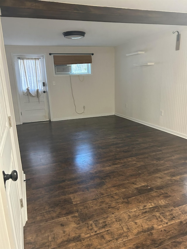 spare room with dark hardwood / wood-style flooring