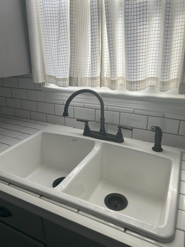 interior details with sink and backsplash